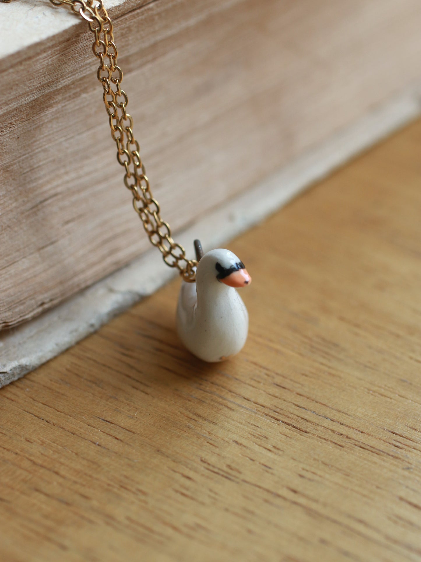 Ceramic Swan necklace - 22k gold details