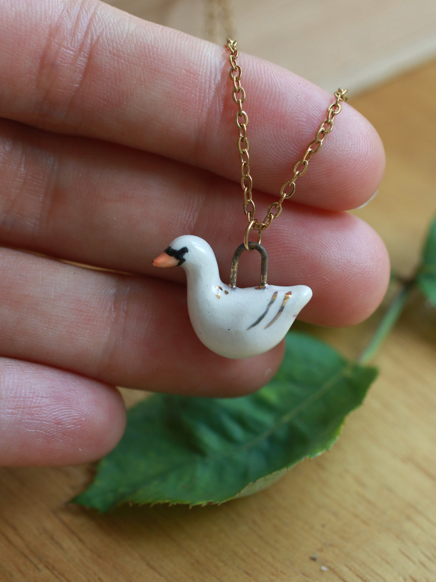 Ceramic Swan necklace - 22k gold details