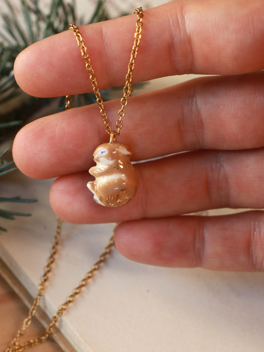Sleeping bunny necklace in a walnut box