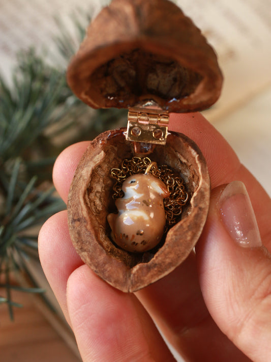 Sleeping bunny necklace in a walnut box