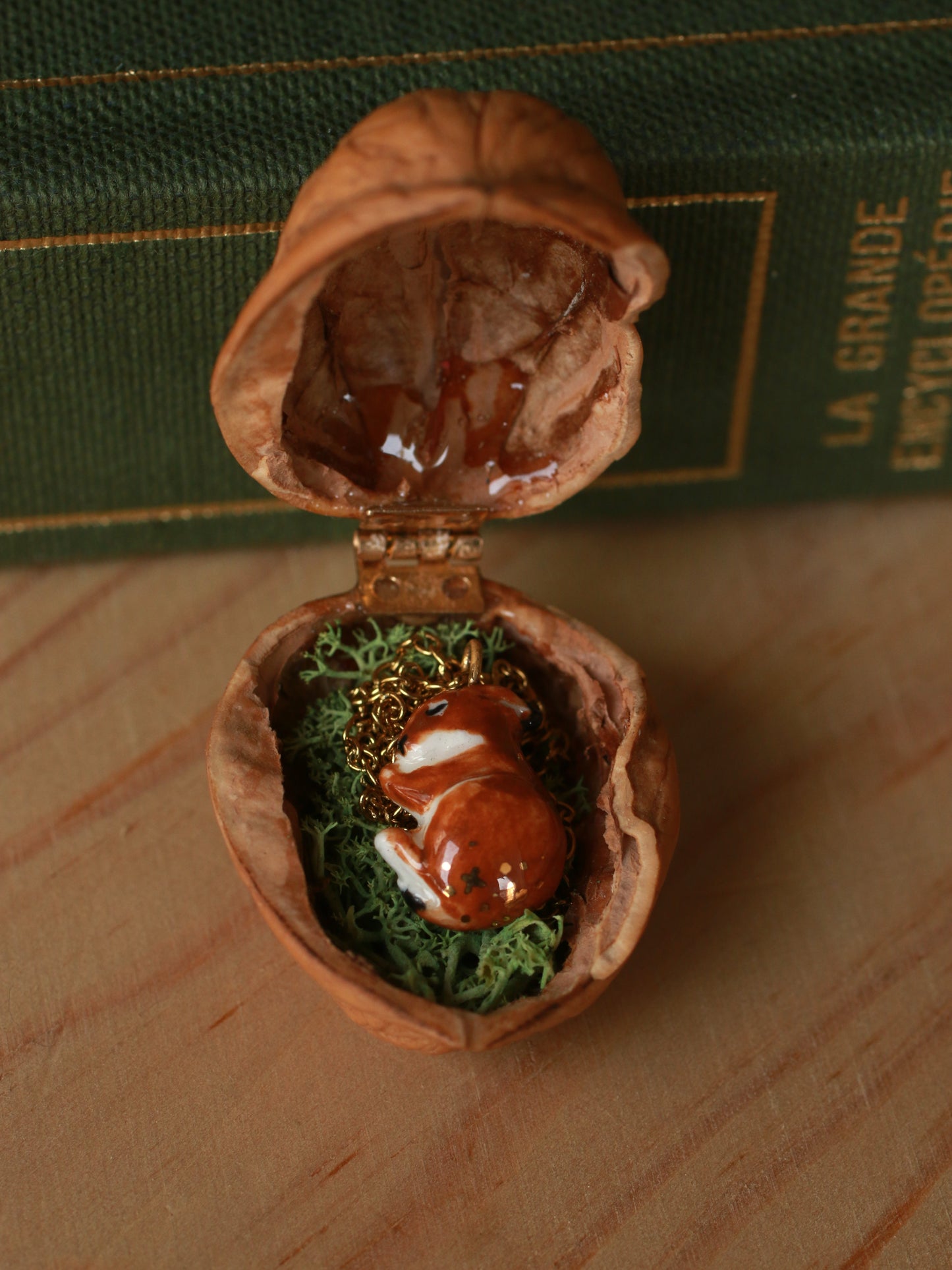 Sleeping bunny necklace in a walnut box