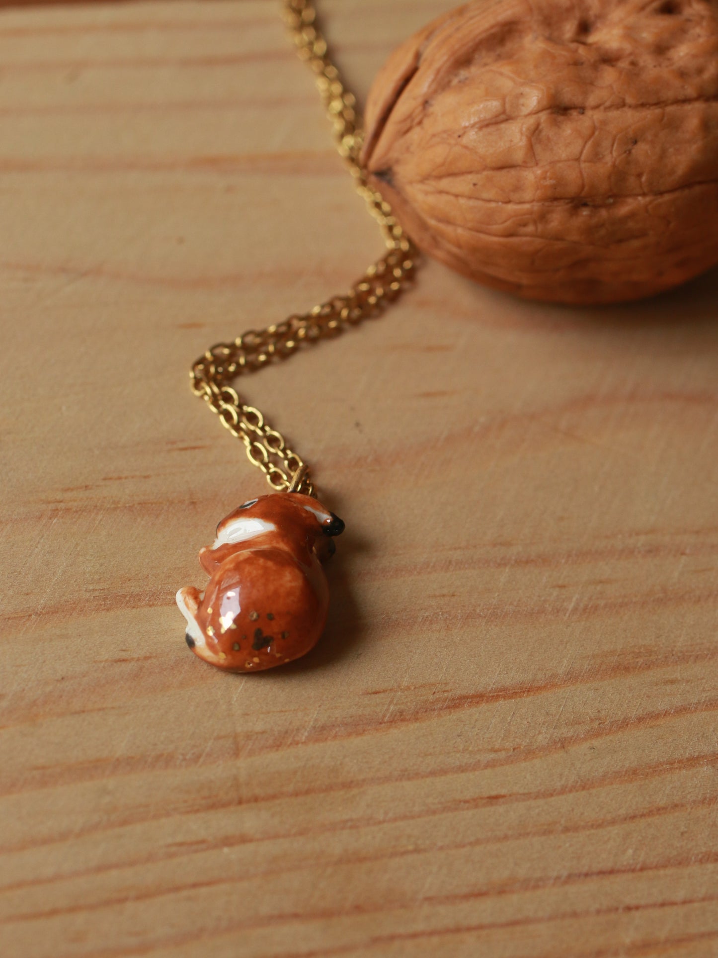 Sleeping bunny necklace in a walnut box