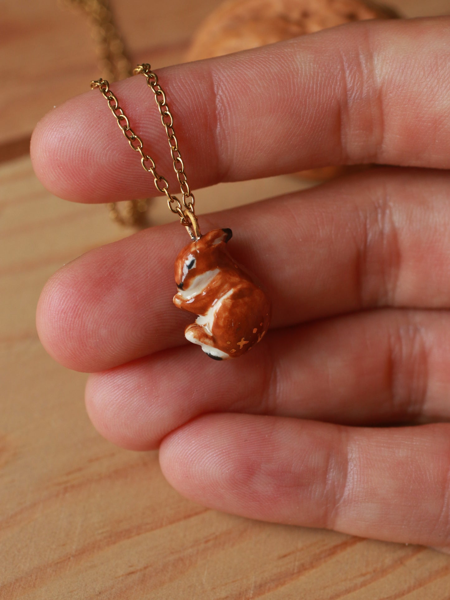 Sleeping bunny necklace in a walnut box