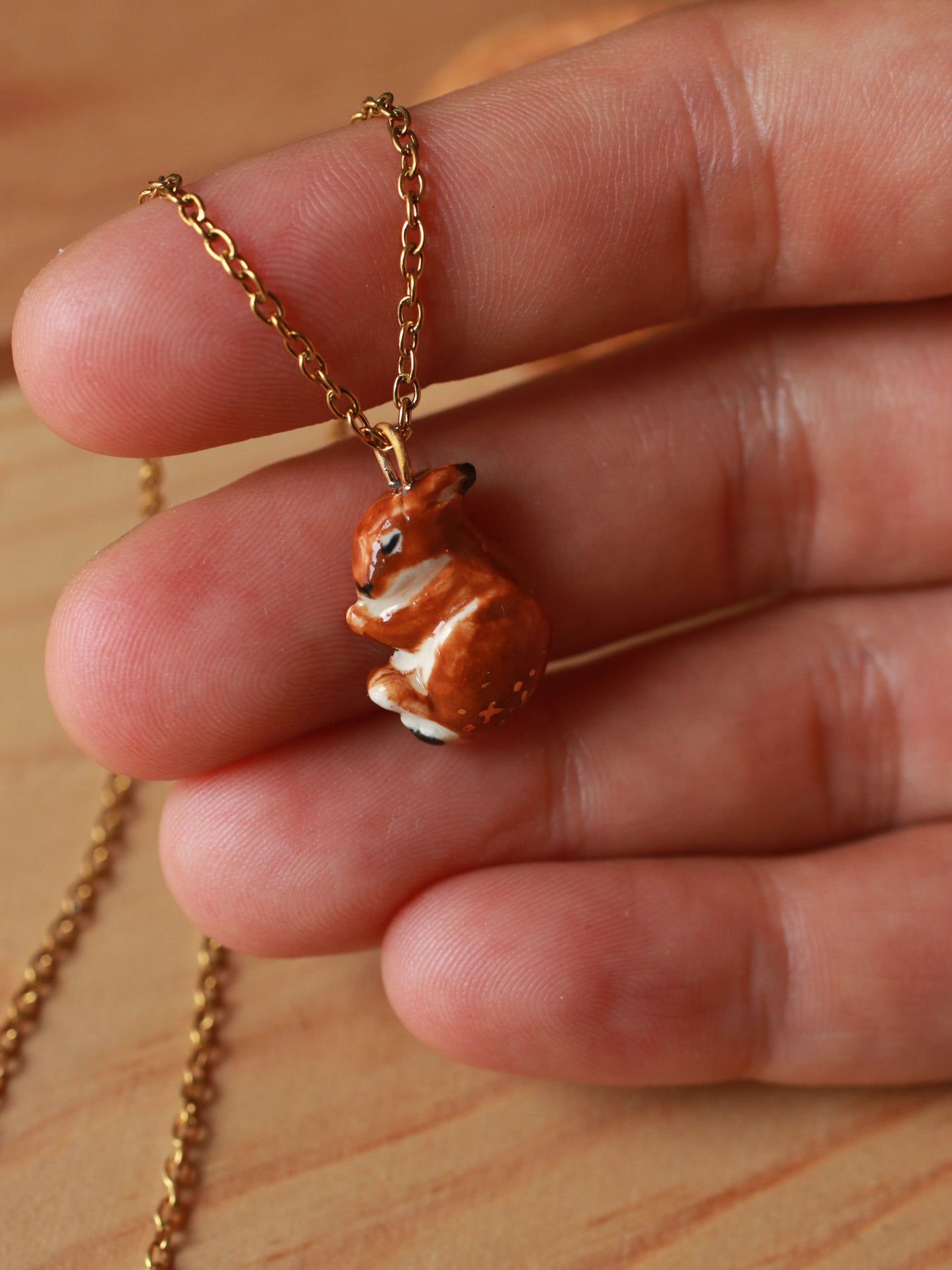 Sleeping bunny necklace in a walnut box