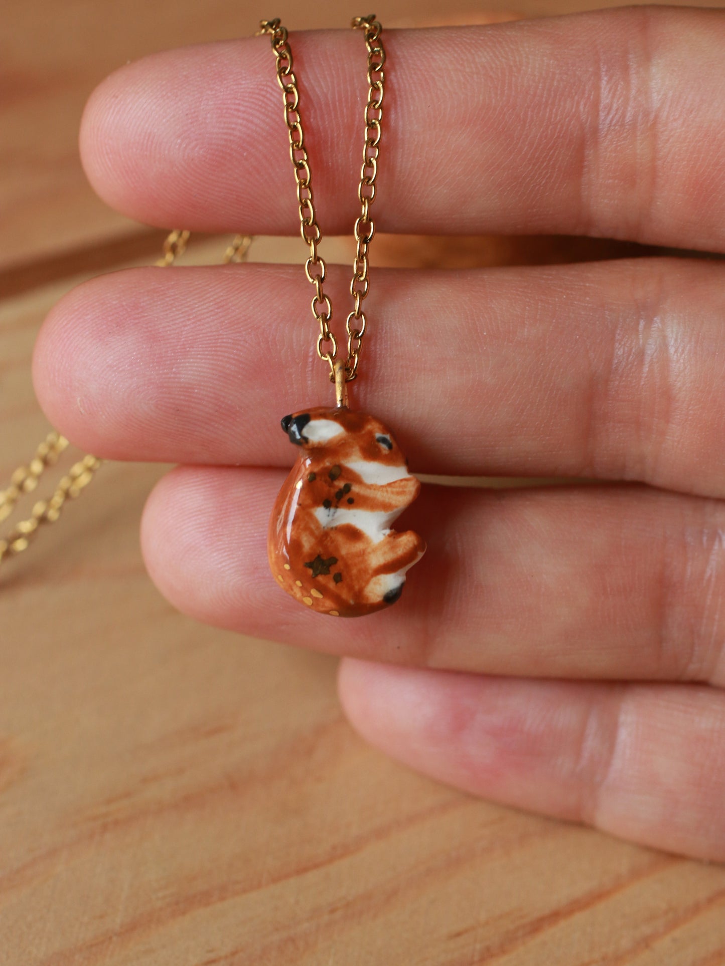 Sleeping bunny necklace in a walnut box